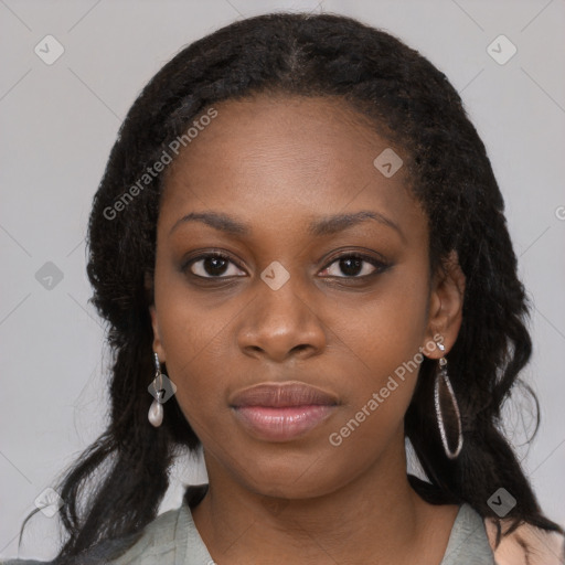 Joyful black young-adult female with long  black hair and brown eyes