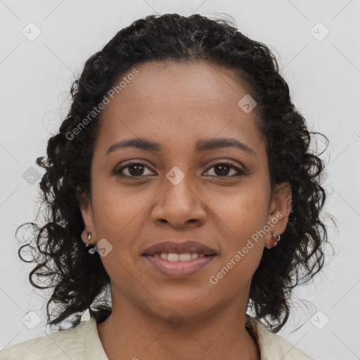 Joyful black young-adult female with long  brown hair and brown eyes