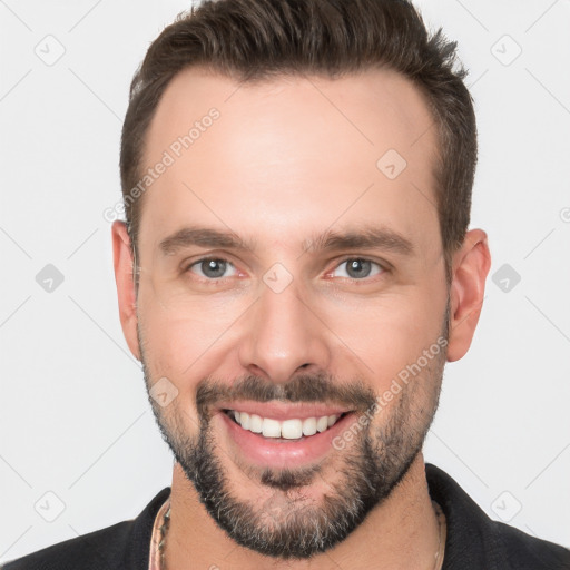 Joyful white young-adult male with short  brown hair and brown eyes