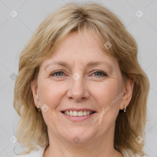 Joyful white adult female with medium  brown hair and blue eyes