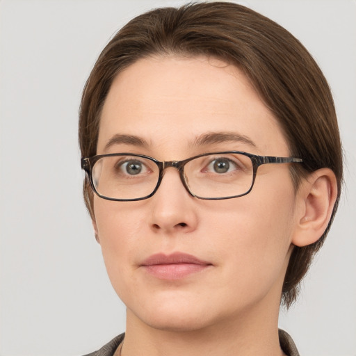 Neutral white young-adult female with medium  brown hair and grey eyes