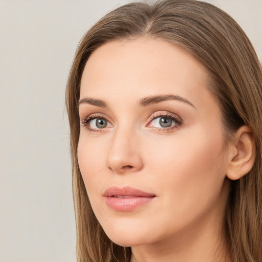 Neutral white young-adult female with long  brown hair and grey eyes