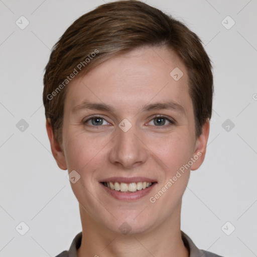 Joyful white young-adult female with short  brown hair and grey eyes