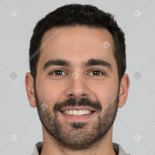 Joyful white young-adult male with short  black hair and brown eyes