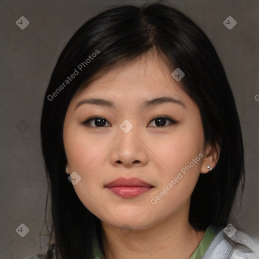 Joyful asian young-adult female with medium  black hair and brown eyes