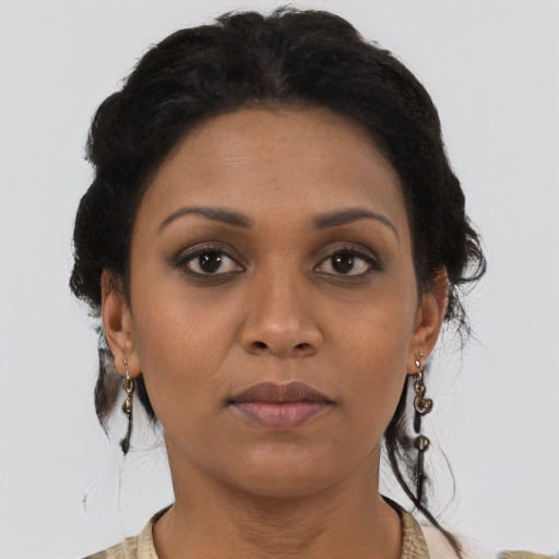 Neutral black adult female with short  brown hair and brown eyes