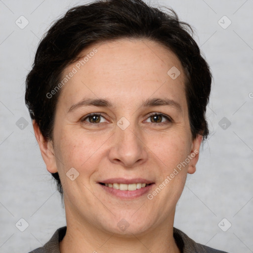 Joyful white adult female with short  brown hair and brown eyes