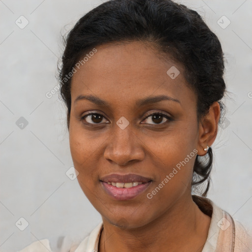 Joyful black young-adult female with short  brown hair and brown eyes