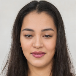 Joyful asian young-adult female with long  brown hair and brown eyes