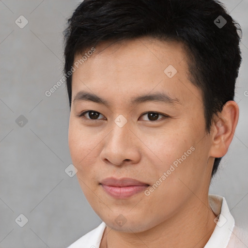 Joyful asian young-adult male with short  brown hair and brown eyes