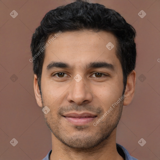 Joyful latino young-adult male with short  black hair and brown eyes