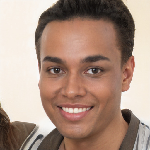 Joyful white young-adult male with short  brown hair and brown eyes