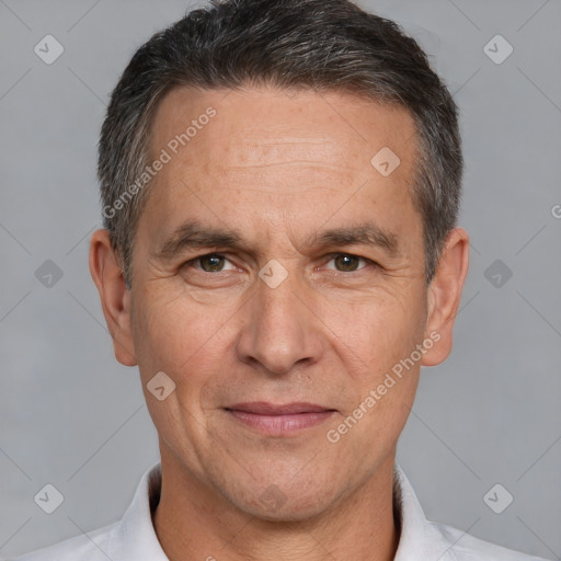 Joyful white adult male with short  brown hair and brown eyes