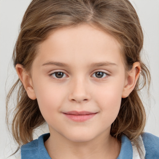 Joyful white child female with medium  brown hair and grey eyes