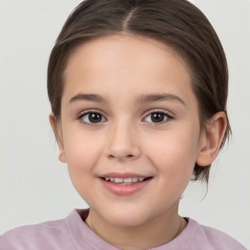 Joyful white child female with medium  brown hair and brown eyes