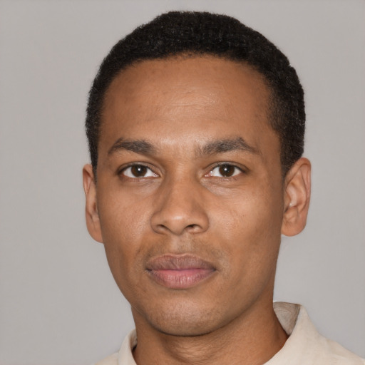 Neutral black adult male with short  black hair and brown eyes