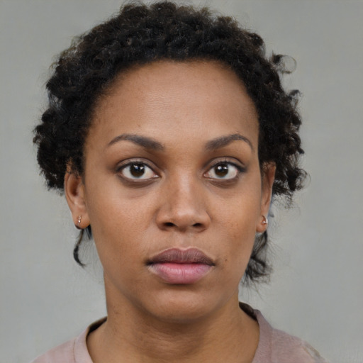 Neutral black young-adult female with short  brown hair and brown eyes