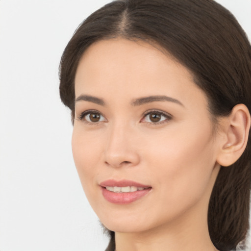 Joyful asian young-adult female with long  brown hair and brown eyes