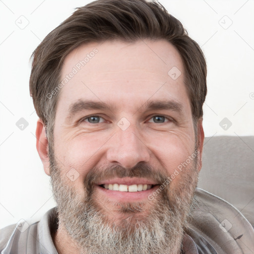 Joyful white adult male with short  brown hair and grey eyes