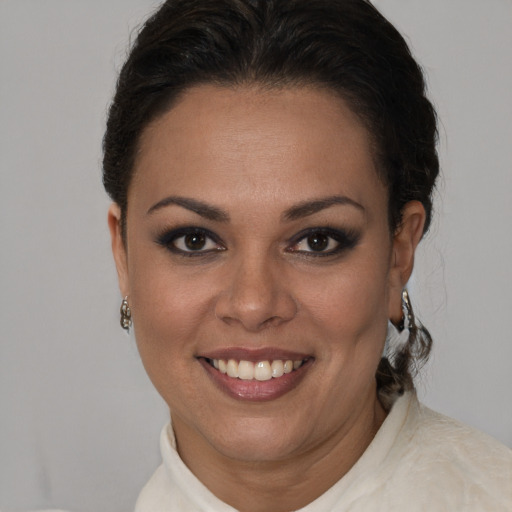 Joyful latino young-adult female with short  brown hair and brown eyes
