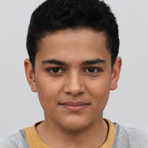 Joyful latino child male with short  brown hair and brown eyes