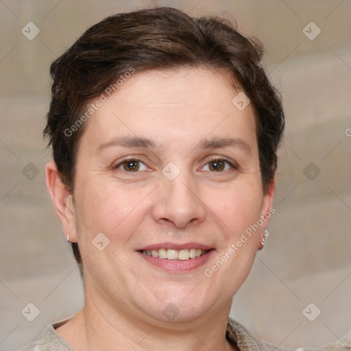 Joyful white adult female with short  brown hair and grey eyes