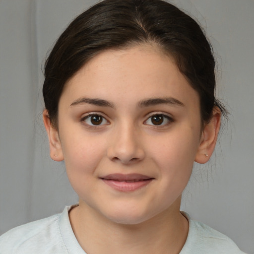 Joyful white child female with medium  brown hair and brown eyes