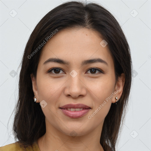 Joyful asian young-adult female with long  brown hair and brown eyes