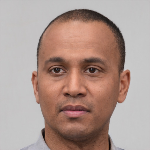 Neutral latino adult male with short  black hair and brown eyes