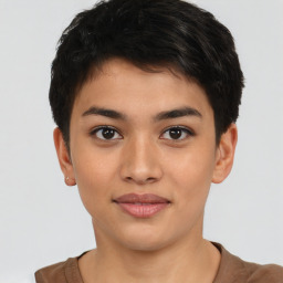 Joyful latino young-adult female with short  black hair and brown eyes