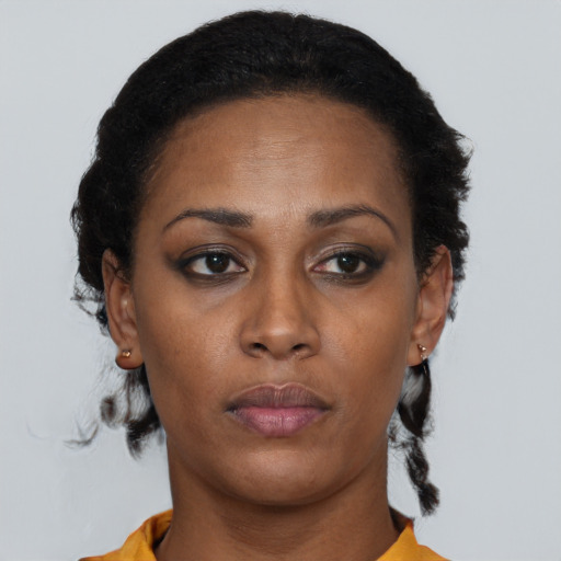 Neutral black adult female with short  black hair and brown eyes