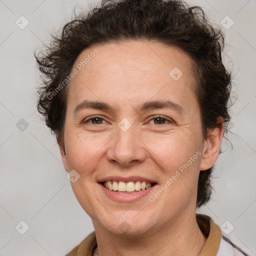 Joyful white adult female with short  brown hair and brown eyes