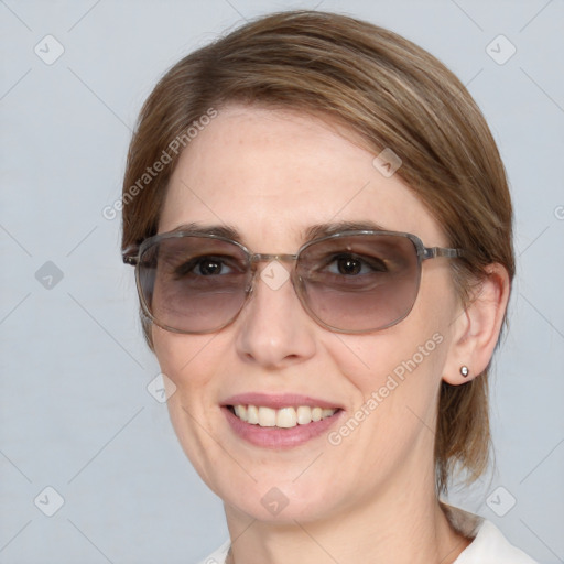 Joyful white young-adult female with medium  brown hair and blue eyes