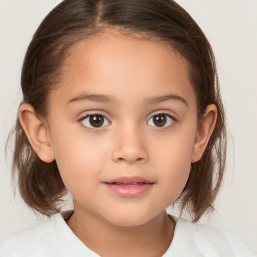 Joyful white child female with medium  brown hair and brown eyes