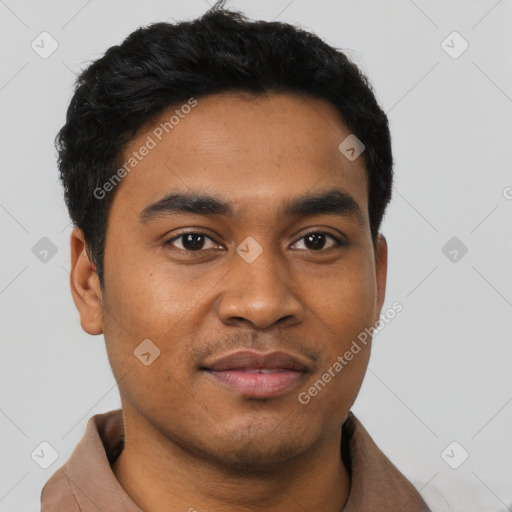 Joyful latino young-adult male with short  black hair and brown eyes