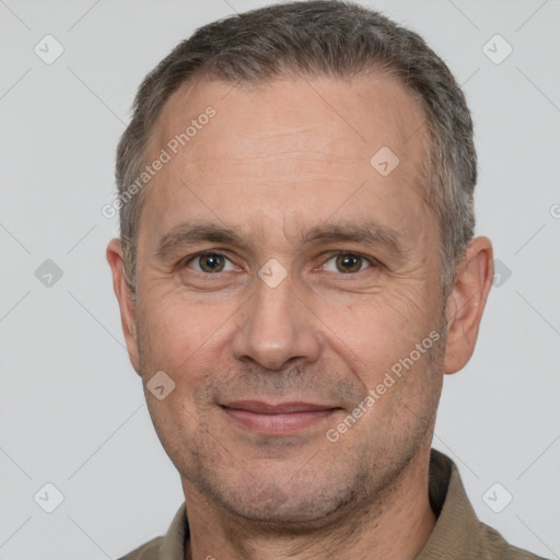 Joyful white adult male with short  brown hair and brown eyes