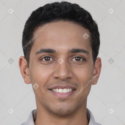 Joyful latino young-adult male with short  black hair and brown eyes