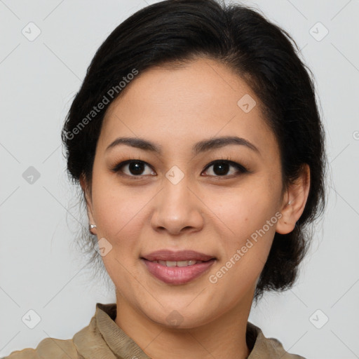 Joyful latino young-adult female with medium  brown hair and brown eyes