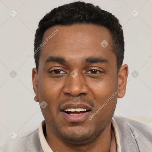 Joyful black young-adult male with short  black hair and brown eyes