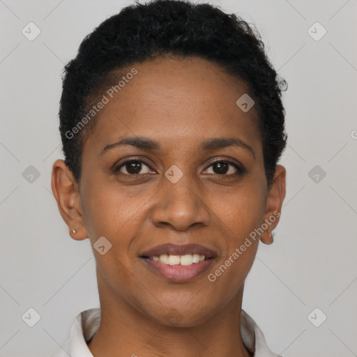 Joyful black young-adult female with short  black hair and brown eyes