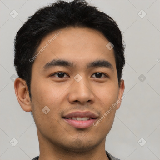 Joyful latino young-adult male with short  black hair and brown eyes