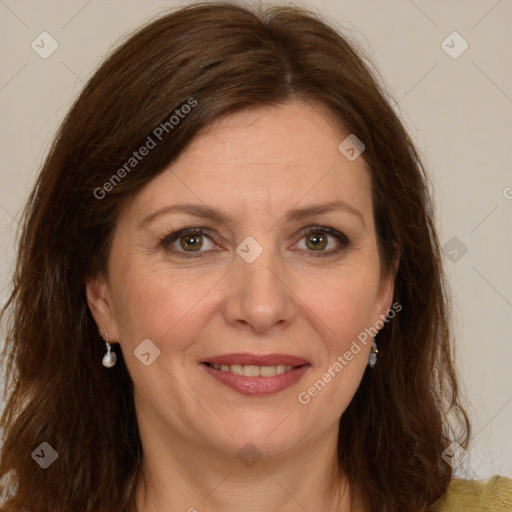 Joyful white adult female with long  brown hair and brown eyes