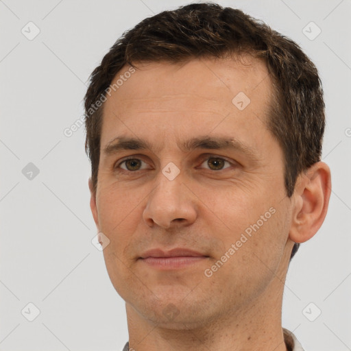 Joyful white adult male with short  brown hair and brown eyes