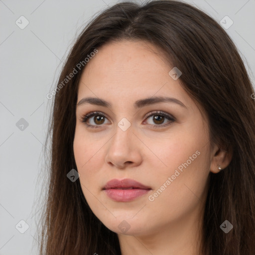 Neutral white young-adult female with long  brown hair and brown eyes