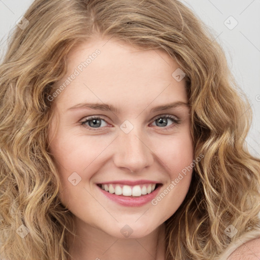 Joyful white young-adult female with long  brown hair and green eyes