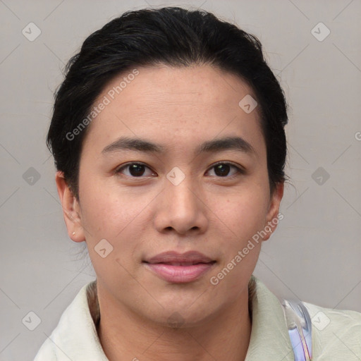 Joyful asian young-adult female with short  brown hair and brown eyes