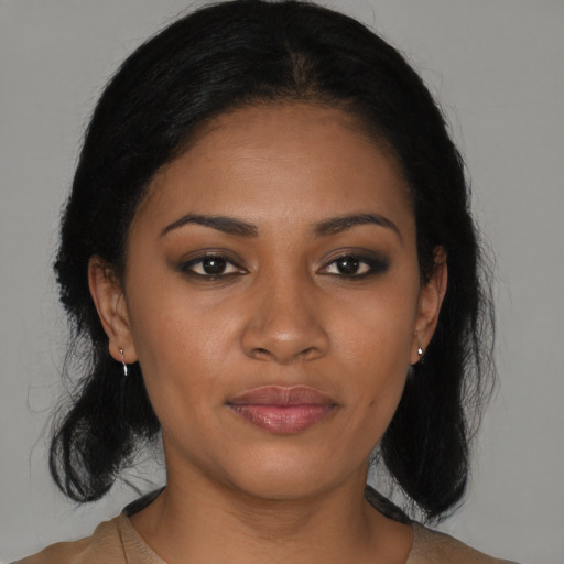 Joyful black young-adult female with medium  black hair and brown eyes