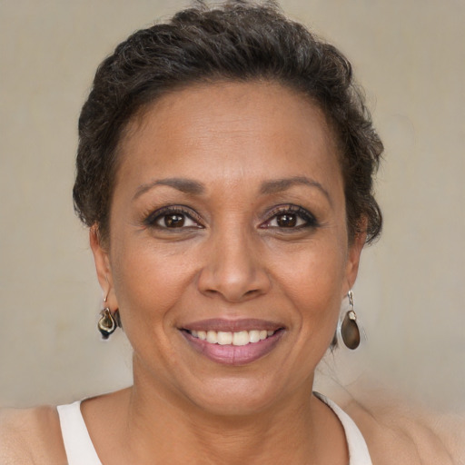 Joyful white adult female with short  brown hair and brown eyes
