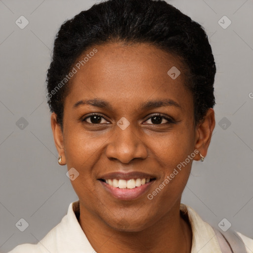 Joyful black young-adult female with short  black hair and brown eyes