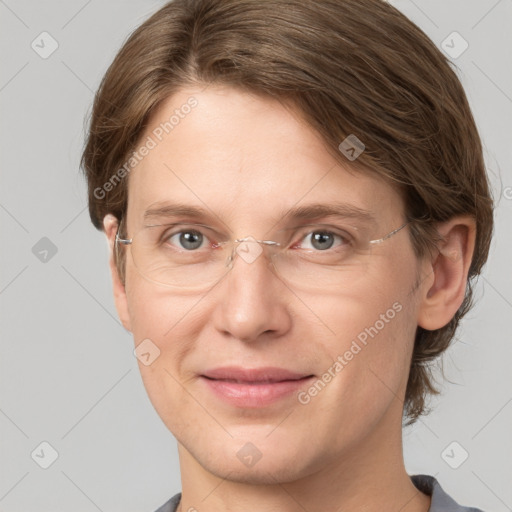 Joyful white adult female with short  brown hair and grey eyes